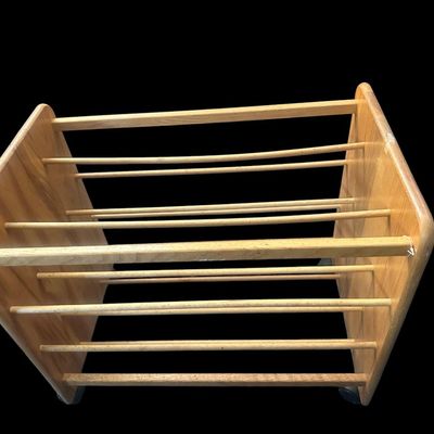 Sale Photo Thumbnail #979: 24"T × 28"L × 17.5"W Solid light wood mobile caddy featuring multi-tiered horizontal wooden dowel racks  solid end panels  and swivel caster wheels. Dimensions: 24" Tall x 28" Long x 17.50" Wide.  