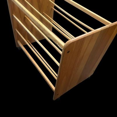 Sale Photo Thumbnail #981: 24"T × 28"L × 17.5"W Solid light wood mobile caddy featuring multi-tiered horizontal wooden dowel racks  solid end panels  and swivel caster wheels. Dimensions: 24" Tall x 28" Long x 17.50" Wide.  