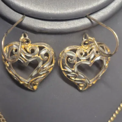 Sale Photo Thumbnail #231: Filigree Heart Pendant on chain link gold tone chain w/ lobster closure
> pendant is 1.5" dia.  chain is 16" long
> pendant is open filigree both sides.............unbranded
Sterling silver Heart shaped Earrings ~ marked sterling reverse side
>1.25" total