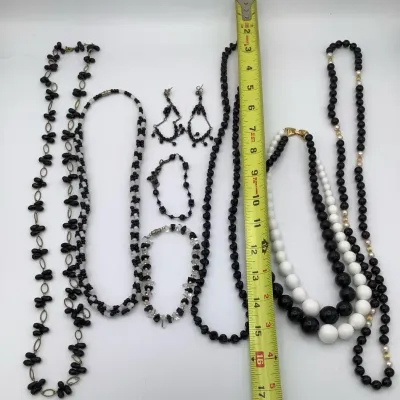 Sale Photo Thumbnail #279: 5 necklaces, one bracelet, one pair of earrings and one anklet
all in excellent condition.