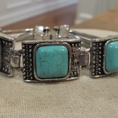 Sale Photo Thumbnail #56: Silver tone and Turquoise Southwest style bracelet 7" length.
width 1.5" / 7" with snap closure
VG condition, stones perfect
