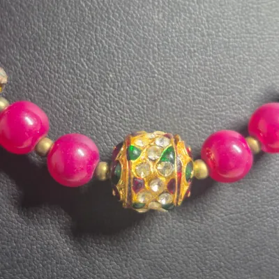 Sale Photo Thumbnail #33: This is a bright pink/magenta beaded necklace and matching earring set featuring vibrant round beads, silver-tone diamond-shaped drop earrings with matching stones, and accent beads
> second earring set is a butterfly w/rhinestones.....for that Fun Evenin