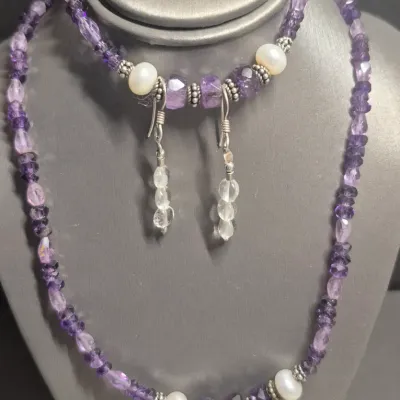 Sale Photo Thumbnail #99: Stunning Lilac set Necklace / Bracelet / Earring
Necklace is 12" with toggle fastner
> bracket has lilac clear beads w/ faux pearls and metal spacers
> pierced earrings are clear beads dangle