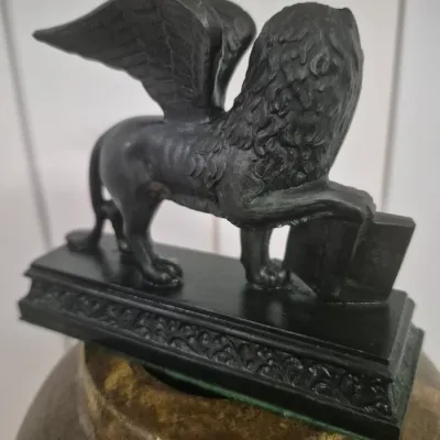 Sale Photo Thumbnail #8: Vintage neoclassical spelt sculpture of the winged lion of Saint Mark
vintage patinated  statue depicting the winged lion of Saint Mark, the the emblem of Venice, Italy.
The statue is likely a grand tour souvenir, very popular in the 19th and early 20th c