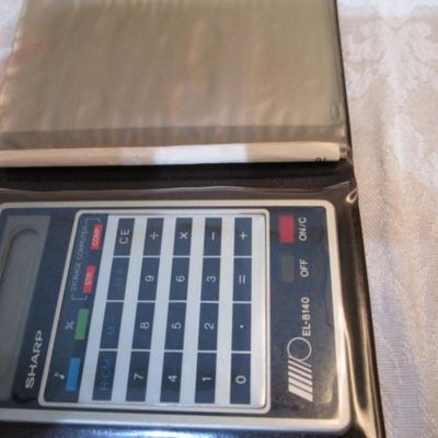 Sale Photo Thumbnail #281: 6 new solar credit card calculators with cases, 2 PF calculators, 1 Elsemate has a stopwatch, calculator & alarm (needs battery), Sharp EL8140 wallet calculator needs battery), see pictures
