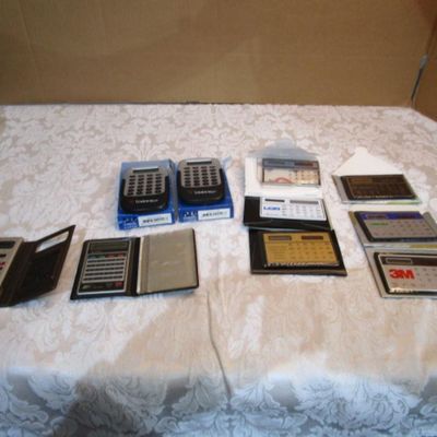 Sale Photo Thumbnail #273: 6 new solar credit card calculators with cases, 2 PF calculators, 1 Elsemate has a stopwatch, calculator & alarm (needs battery), Sharp EL8140 wallet calculator needs battery), see pictures