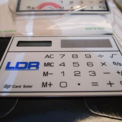 Sale Photo Thumbnail #278: 6 new solar credit card calculators with cases, 2 PF calculators, 1 Elsemate has a stopwatch, calculator & alarm (needs battery), Sharp EL8140 wallet calculator needs battery), see pictures