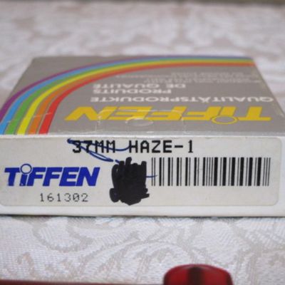 Sale Photo Thumbnail #310: Vintage Tiffen 37 mm Hayes-1 camera lens filter, 30 letter-size envelopes, 5 legal pads 5" x 7" (one with pad holder), 100+ index cards, 2 notepads, 1 pr. wireless headphones (uses C adapter not included), nameplate holder, see pictures