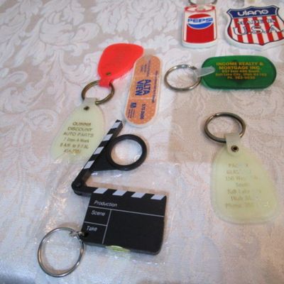 Sale Photo Thumbnail #320: 2 rubber stamps, pocket sewing kit, 31 Vintage keychains (one opens to a magnifying glass and is new), 1 badge holder, see pictures