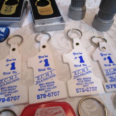 Sale Photo Thumbnail #315: 2 rubber stamps, pocket sewing kit, 31 Vintage keychains (one opens to a magnifying glass and is new), 1 badge holder, see pictures