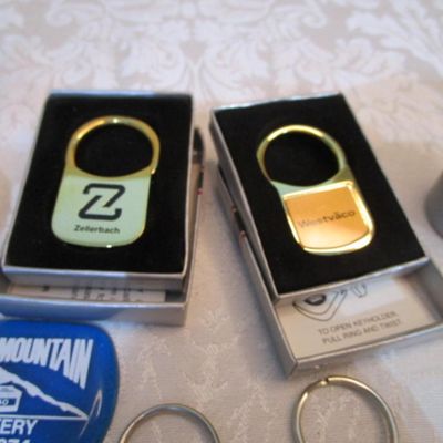 Sale Photo Thumbnail #317: 2 rubber stamps, pocket sewing kit, 31 Vintage keychains (one opens to a magnifying glass and is new), 1 badge holder, see pictures