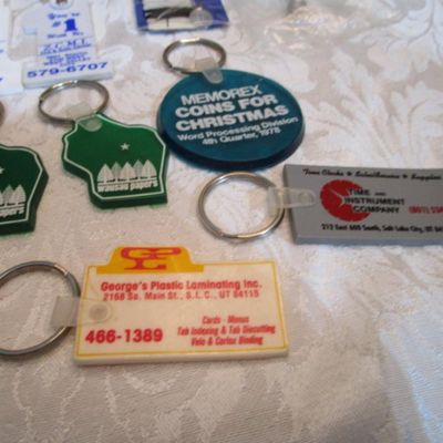 Sale Photo Thumbnail #313: 2 rubber stamps, pocket sewing kit, 31 Vintage keychains (one opens to a magnifying glass and is new), 1 badge holder, see pictures