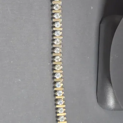 Sale Photo Thumbnail #83: Vintage gold tone Tennis Bracelet ~ Cz stones & MCM design
> each stone is housed in a square bumper bracelet [bar set]
> round stones give a continuous line of clear faceted CZ stones
> excellent condition / snap clasp / 7.5" long
