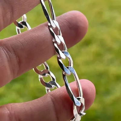 Sale Photo Thumbnail #138: UK Genuine 925 Sterling Silver 7mm Figaro Link Bracelet, marked 925, Rhodium finished, allergy free
Width: 7mm
Length: 8 Inch