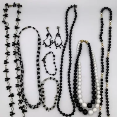 Sale Photo Thumbnail #213: 5 necklaces, one bracelet, one pair of earrings and one anklet
all in excellent condition.