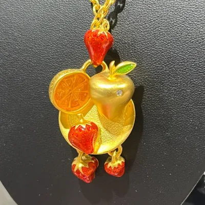 Sale Photo Thumbnail #237: Bob Macky Women's Jewelry - Gold – fruit platter gold tone necklace 
> on a gold curb chain 12" total length
> marked on reverside of pendent