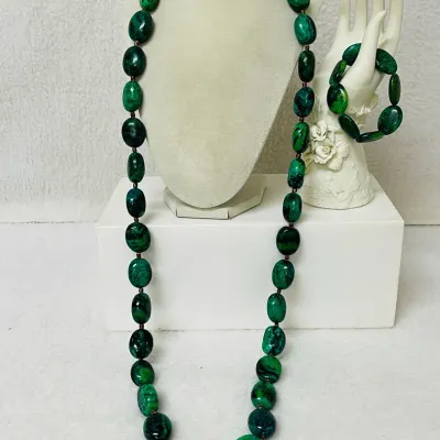 Sale Photo Thumbnail #241: Make a bold statement with this striking Chrysocolla Gemstone Jewelry Set, featuring a 40” long Necklace and coordinating Stretch Bracelet crafted with heavy polished oval Stones in vivid blue-green, emerald and deep black natural matrix patterns.