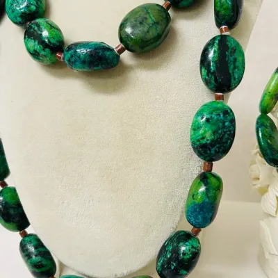 Sale Photo Thumbnail #245: Make a bold statement with this striking Chrysocolla Gemstone Jewelry Set, featuring a 40” long Necklace and coordinating Stretch Bracelet crafted with heavy polished oval Stones in vivid blue-green, emerald and deep black natural matrix patterns.