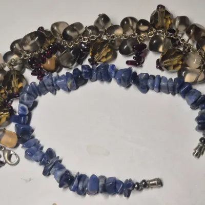 Sale Photo Thumbnail #247: Set of 2 bangles .....earth tones with heavily stacked beads
Blue chip stones w/ magnetic clasp
both VGC