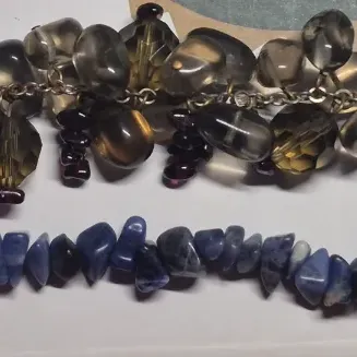 Sale Photo Thumbnail #248: Set of 2 bangles .....earth tones with heavily stacked beads
Blue chip stones w/ magnetic clasp
both VGC