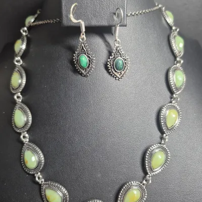 Sale Photo Thumbnail #87: Silvertone marcasite jewelry set includes a necklace, and earrings featuring aventurine stones. The pieces are adorned with marcasite stones, giving them a unique and stylish look.  Lobster clasp and 3" extenetion
Earrings marked 925 on pierced loops