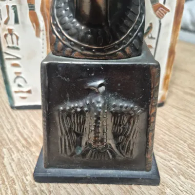 Sale Photo Thumbnail #198: Vintage Egyptian Revival Nefertiti ~ metal bronzed  bust statue w/Decorative tile
>cast metal w/bronzed patina finish
> base embossed winged eagle / falcon relief
> condition: beautiful vintage condition, no cracks breaks or structural damage....felt base
