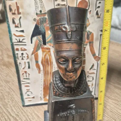 Sale Photo Thumbnail #197: Vintage Egyptian Revival Nefertiti ~ metal bronzed  bust statue w/Decorative tile
>cast metal w/bronzed patina finish
> base embossed winged eagle / falcon relief
> condition: beautiful vintage condition, no cracks breaks or structural damage....felt base