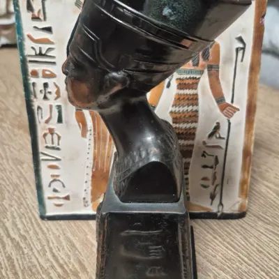 Sale Photo Thumbnail #199: Vintage Egyptian Revival Nefertiti ~ metal bronzed  bust statue w/Decorative tile
>cast metal w/bronzed patina finish
> base embossed winged eagle / falcon relief
> condition: beautiful vintage condition, no cracks breaks or structural damage....felt base