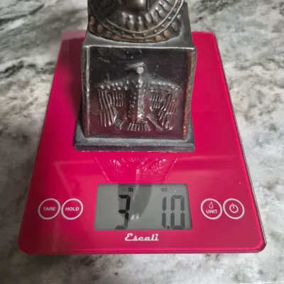 Sale Photo Thumbnail #204: Vintage Egyptian Revival Nefertiti ~ metal bronzed  bust statue w/Decorative tile
>cast metal w/bronzed patina finish
> base embossed winged eagle / falcon relief
> condition: beautiful vintage condition, no cracks breaks or structural damage....felt base
