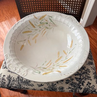 Large vintage ceramic wash basin bowl featuring a wheat stalk pattern and embossed scrolled handles.