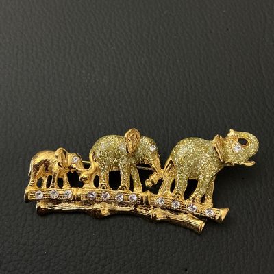 Gold-Tone Elephant Family Brooch with Rhinestones and Glitter Detail