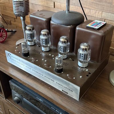 Sale Photo Thumbnail #80: Vintage Harman Kardon Citation II stereophonic high fidelity vacuum tube power amplifier alongside two vintage tabletop microphones.