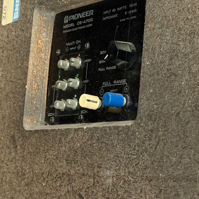 Sale Photo Thumbnail #162: Rear connection panel of a vintage Pioneer Model CS-A700 speaker, featuring multi-channel and full-range input terminals with level adjustment knobs.