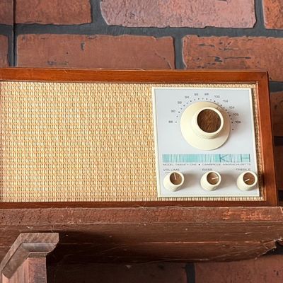 Sale Photo Thumbnail #166: Vintage KLH Model Twenty-One FM table radio featuring a wood cabinet and woven speaker grille.