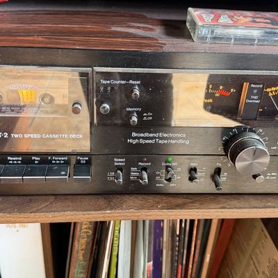 Sale Photo Thumbnail #190: BIC T-2 two-speed stereo cassette tape deck featuring dual VU meters and a wood-grain case, circa late 1970s.