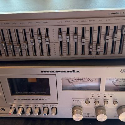 Sale Photo Thumbnail #191: Vintage Marantz Model 5025 stereo cassette deck stacked beneath a Marantz EQ140 graphic stereo equalizer, both featuring brushed silver faceplates from the late 1970s.