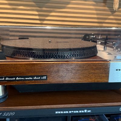 Sale Photo Thumbnail #193: Vintage Marantz Model 6300 servo control direct drive turntable featuring a wood plinth and plastic dust cover.