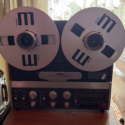 Sale Photo Thumbnail #200: Revox reel-to-reel tape recorder fitted with Maxell reels, sitting atop a Klipsch speaker cabinet.