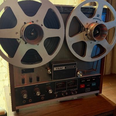Sale Photo Thumbnail #201: Vintage TEAC 3300S reel-to-reel tape deck with large Pioneer metal reels, housed in a wood cabinet.