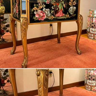 Sale Photo Thumbnail #4: Asian-style hand-painted lacquer accent table featuring floral motifs, figures, and gilt cabriole legs with carved acanthus leaf details.