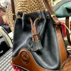 Sale Photo Thumbnail #4: Vintage Dooney & Bourke All Weather Leather drawstring bucket bag in black and tan pebble grain leather.