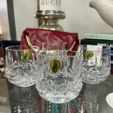 Sale Photo Thumbnail #10: Set of Waterford cut crystal double old fashioned glasses featuring gold foil seahorse maker's stickers, shown in good condition.