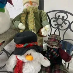 Sale Photo Thumbnail #49: Collection of plush snowman winter decorations featuring various hats, scarves, and fabric outfits.