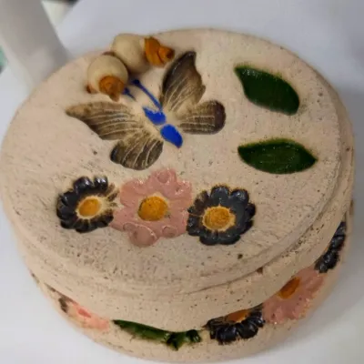 Sale Photo Thumbnail #103: Handcrafted ceramic trinket box featuring a textured lid decorated with painted butterflies, leaves, flowers, and beaded accents.