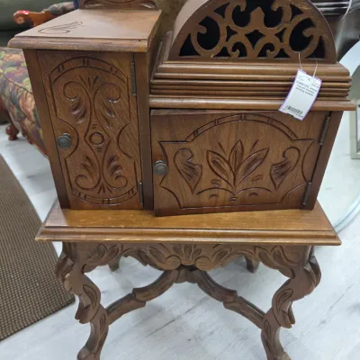 Sale Photo Thumbnail #113: Antique carved wooden smoking humidor table with intricate scrollwork, dual doors, and cabriole legs.