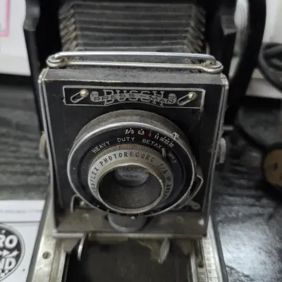 Sale Photo Thumbnail #136: Vintage Busch Pressman folding camera equipped with a Graflex Photorecord f/5 lens and Betax No. 2 shutter.