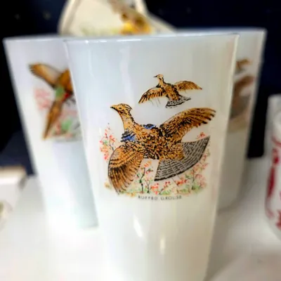Sale Photo Thumbnail #205: Vintage white milk glass tumblers featuring colorful illustrations of game birds, including a ruffed grouse, in good condition.