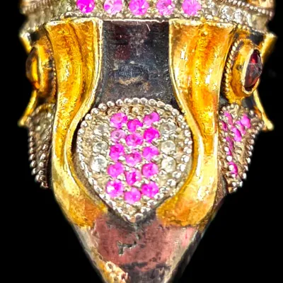 Sale Photo Thumbnail #288: Ornate owl-form statement ring featuring gold-tone accents, pave-set pink and white rhinestones, and bezel-set red stone eyes.