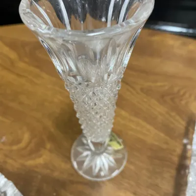 Sale Photo Thumbnail #293: Small crystal bud vase featuring a diamond-cut pattern, flared fluted rim, and starburst base.