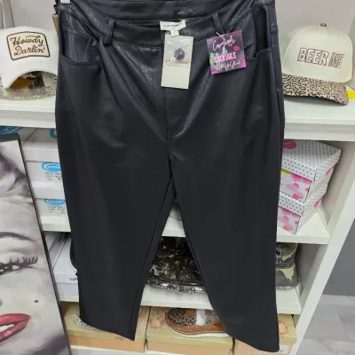 Sale Photo Thumbnail #360: Pair of Ecosome black faux leather pants with original tags attached, displayed on a hanger.